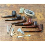 A Group of vintage smoking pipes to include a falcon pipe and others along with a table top