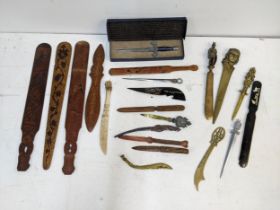 A collection of paper knives and page turners, to include a Scrimshaw decorated with reindeer