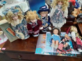 Late 20th century collectors dolls, mainly on stands, together with dolls of the World and other