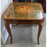 A Sorrento parquetry inlaid games table having removeable top with changeable game tops 75cm h x