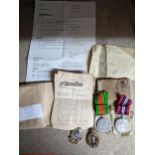 A WWII defence and British War Medal campaign group with ribbons and card box as issued, together