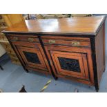 A Victorian walnut sideboard having two drawers above two carved panelled doors Location: