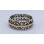 A 9ct gold eternity band inset with paste stones Location: RING