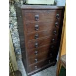 An early 20th century oak tallboy chest of seven graduated drawers on bracket feet 118cm x 62cm x