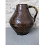 An 18th century Western Asian copper and brass jug Location: