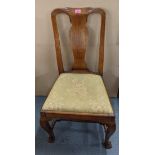 An early 20th century Queen Anne style walnut framed dining chair united by four stretchers,