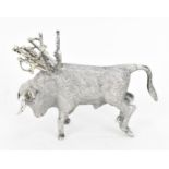 A Continental silver novelty cocktail stick holder modelled as a Toro bull, with sticks shaped as