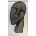 A carved stone sculpture of a head, unsigned Location: