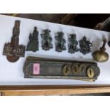 A selection of Edwardian brass door furniture to include six bedroom door knockers comprising Judy