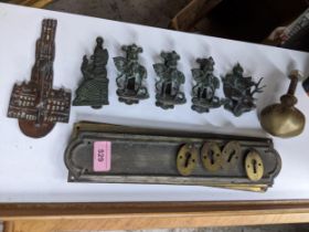 A selection of Edwardian brass door furniture to include six bedroom door knockers comprising Judy