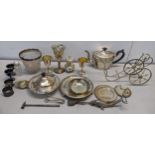 A mixed lot of silver plate to include a muffin dish, napkin rings, teapot and other items
