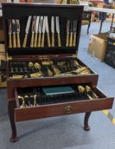 A late 20th century mahogany cutlery table containing mixed Kings pattern gilded cutlery Location: