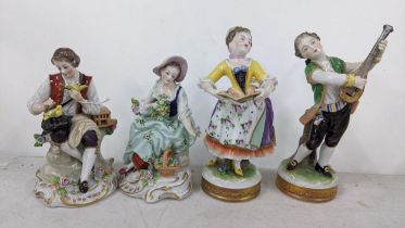 A pair of late 19th century German Vokstedt porcelain figures together with a pair of Studentzdorf