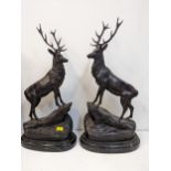 After Jules Moizniez - a pair of late 20th century patinated bronze models of stags on marble