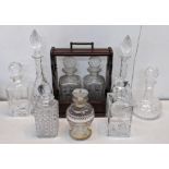 A reproduction mahogany tantalus together with mixed decanters to include a Stuart example Location: