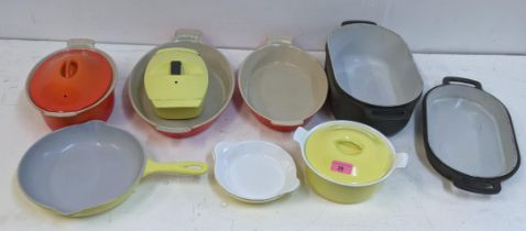 A collection of enamel kitchenware to include some Le Creuset enamel severing and casserole dishes