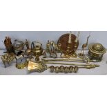 A mixed lot of brassware to include fireside irons, barometer, fire dogs, trench art and other items