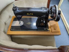 An Alfa and a Singer sewing machine and an Olivette typewriter Location: