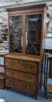 A 19th century mahogany secretaire bookcase having astragal glazed doors above three drawers,