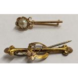 A 9ct gold bar brooch 0.9g together with a yellow metal stick pin brooch A/F 1.5g Location: CAB4