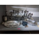 A selection of silver plate and pewter ware to include a pair of candelabras, an hors d'oeuvres dish