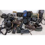 Mixed cameras and accessories to include a Minolta 7000, Exakta, Olympus and others Location: