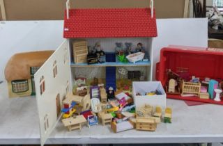 Two dolls houses and contents to include a porcelain bath and sink modern furniture, various dolls