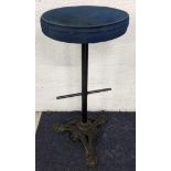 An industrial stool with an upholstered top and cast iron base, 74cm high Location: