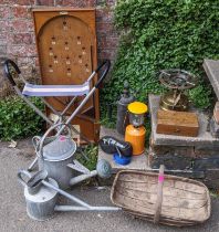 A mixed lot to include early 20th century galvanised watering cans, kumbokatel board and other items