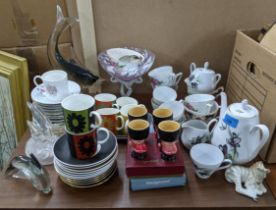 A mixed lot of China and glassware to include art glass fashioned as dolphins, and part tea sets,