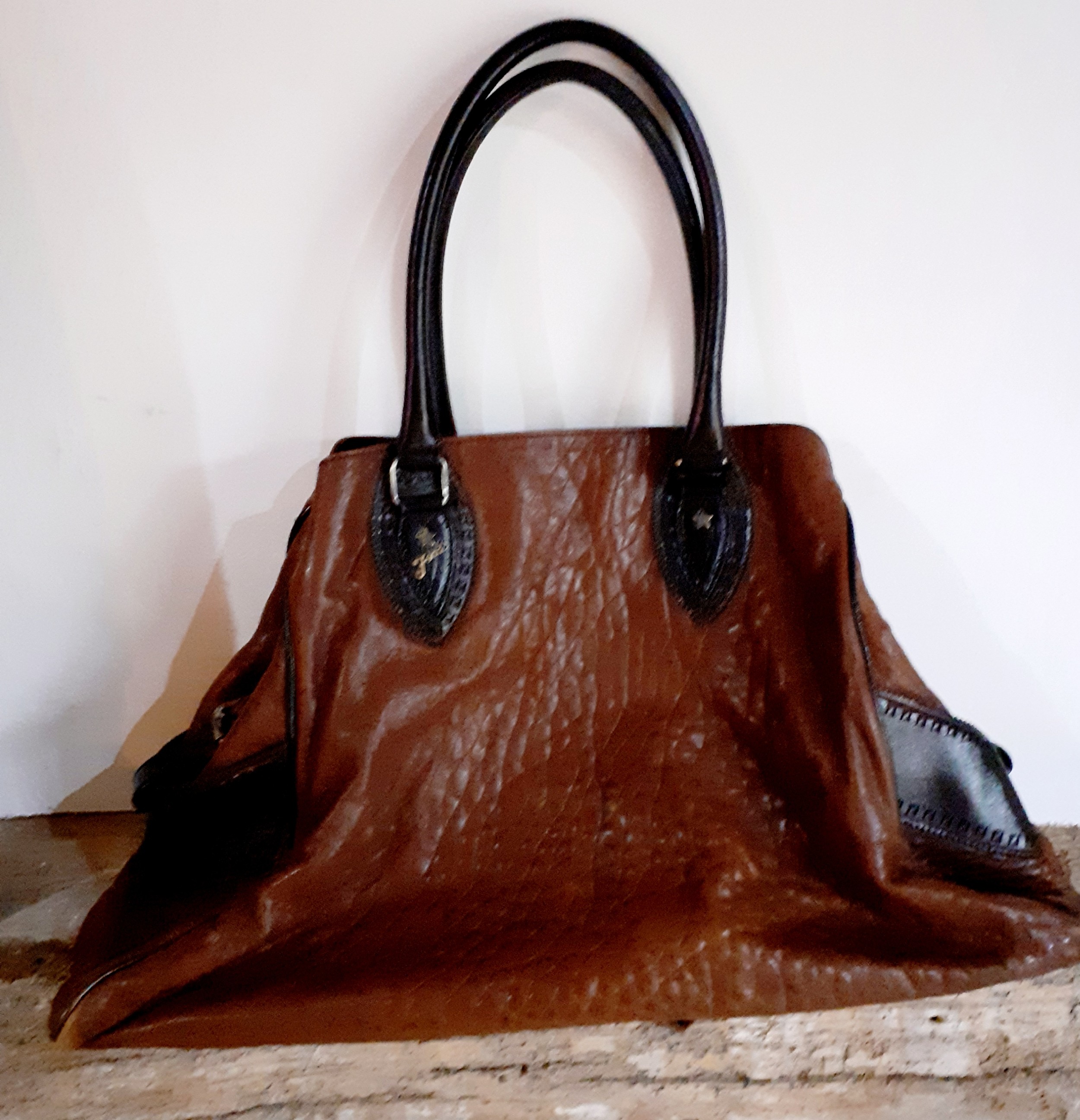 Fendi-A brown leather Selleria boho bag having rolled dark brown leather handles, side pockets,
