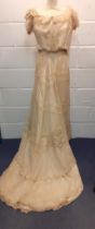 A late Victorian/early Edwardian cream silk lace 2-piece wedding outfit A/F requiring restoration,