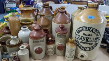 A selection of mainly stoneware flagons to include a Franklins Ginger Beer example 40.5 excluding