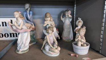 Lladro figures comprising of a girl and woman on the telephone, girls with flowers in their hair and