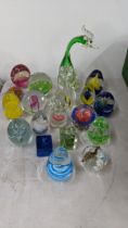 A collection of glass paperweights of various shapes and sizes Location: