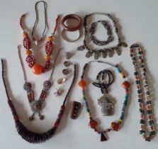 Worldwide jewellery to include a white metal, amber and coral necklace, a white metal and bone