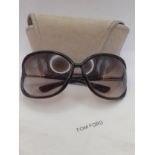 Tom Ford-A pair of brown framed sunglasses with brown ombre lenses and gold tone temples, Model '