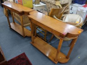 A pair of reproduction Biedermeier style satinwood console tables having string inlaid and turned