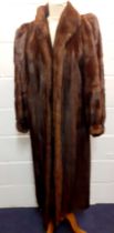 A late 20th Century brown mink full length coat having Juliet sleeves with cuffs, 49" long x 38"