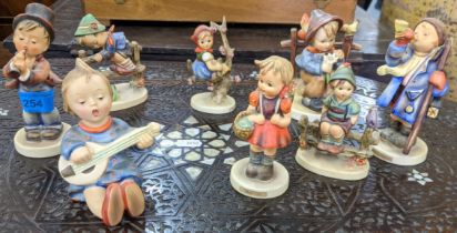 Eight Goebel figures to include Apple Tree girl, School girl, Hear Ye Hear Ye, also a child