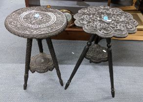 Two Middle Eastern black lacquered heavily carved two tier occasional tables Location: