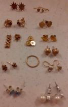 A quantity of yellow metal and 9ct gold pierced earrings and earring backs together with 2