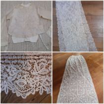 A quantity of lace to include 3metres of Honiton bobbin lace, an Edwardian cream lace wedding veil/