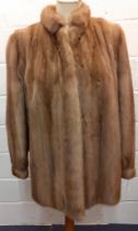 A good quality vintage brown mink jacket having a brown satin lining, bellow arms and cuffs, 40"