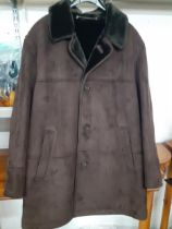 A gent's brown Odermark sheepskin coat, as new, 44"C x 34"Long, together with a Guise faux black