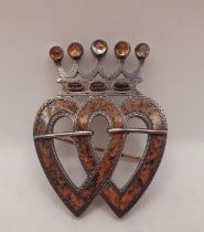 A Scottish white metal and enamelled Luckenbooth brooch of traditional crowned heart design with