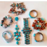 A quantity of turquoise stone and turquoise coloured bead costume bracelets on white metal and