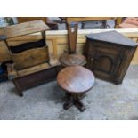 A group of oak furniture to include a spinning chair magazine rack, two low side tables, and a