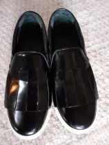 Celine-A pair of 'Kiltie' black glazed leather brogue style casual slip-on shoes with white rubber