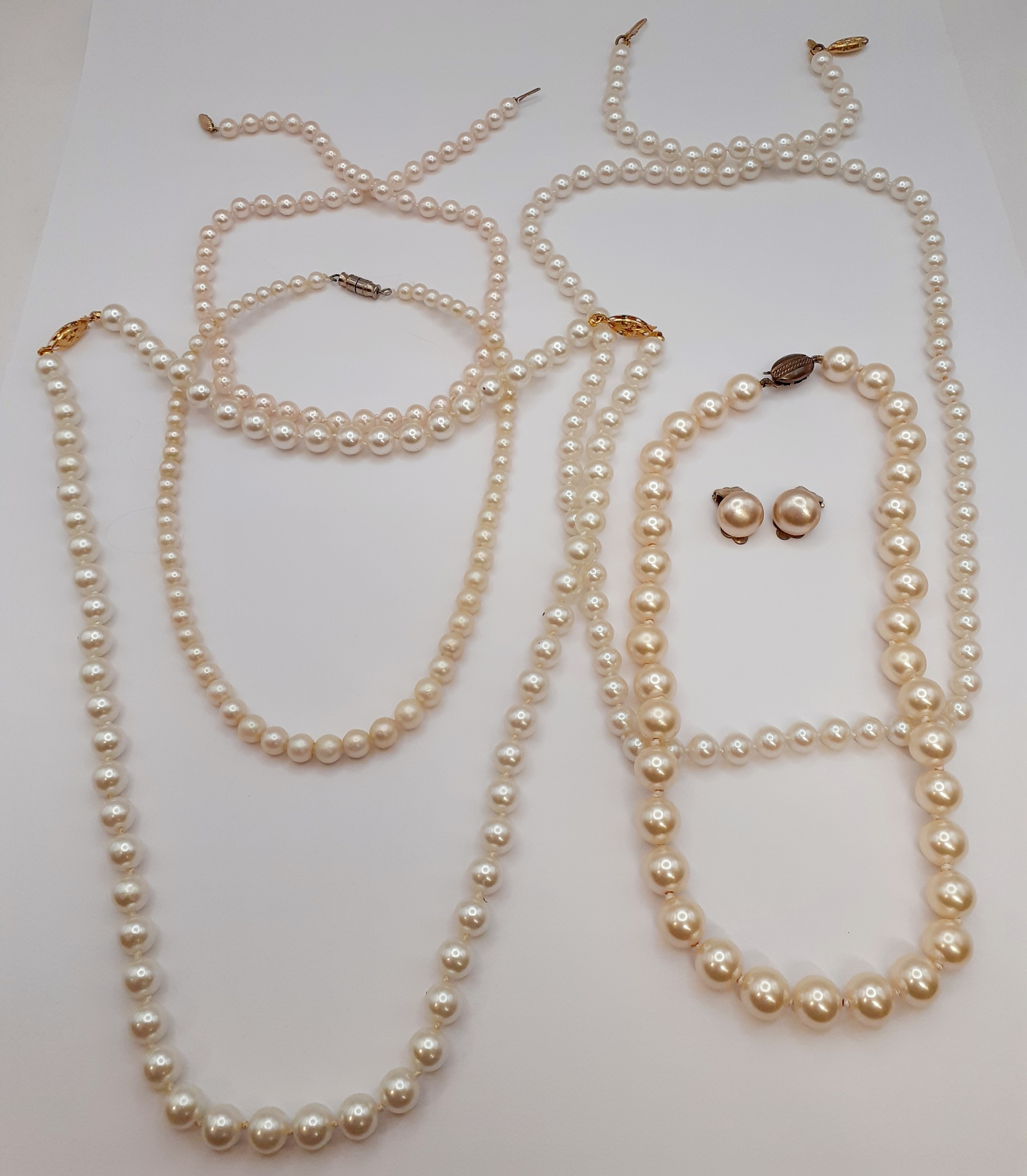 A late 20th Century strand of H.Samuel cultured pearls having a gold tone clasp, a strand of Gulf